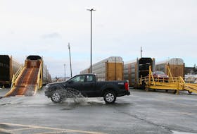 New Ford trucks are driven off railcars at Autoport, near Eastern Passge, on Wednesday. TIM KROCHAK - The Chronicle Herald