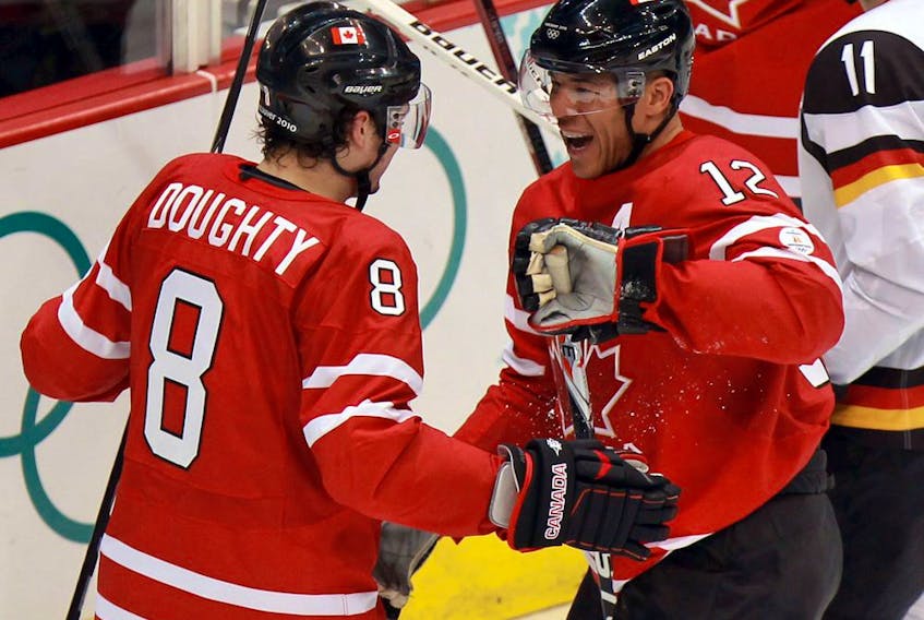 Canada's Jerome Iginla (right) celebrates his second period goal with team-mate Drew Doughty in men's hockey game against Germany in Vancouver BC  Tuesday, February 23, 2010 during the Winter Olympics.  