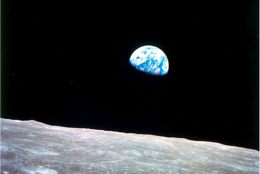  This iconic view of the rising Earth greeted the Apollo 8 astronauts as they came out from behind the moon.