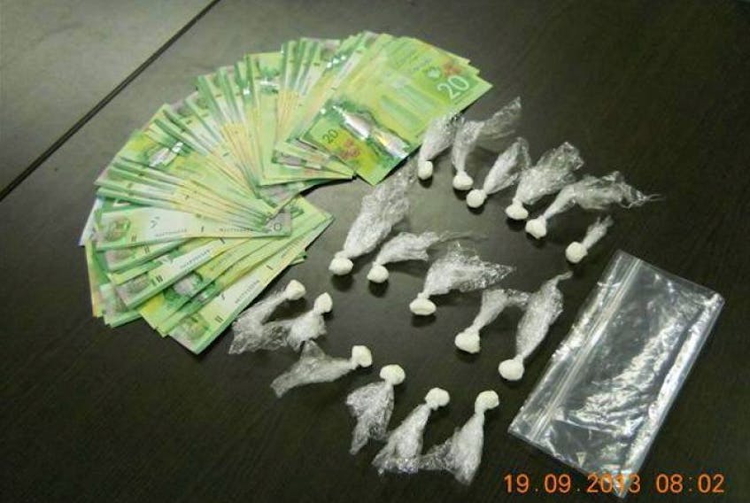 Cocaine, cash and pot were seized in a raid on a Commission Street home on Wednesday night, Sept. 17.