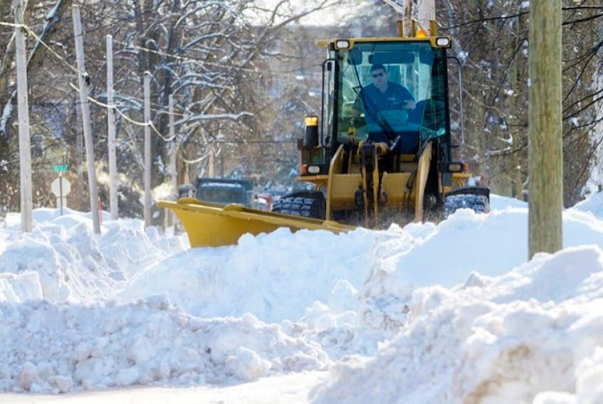<p>A City of Charlottetown plow clears snow after a snowstorm in this Guardian file photo.</p>