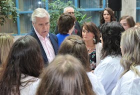 Premier Dwight Ball talks with students in the practical nursing and personal care attendant programs at College of the North Atlantic in Corner Brook following an announcement of expanded health sciences programming on Friday.
Diane Crocker/The Western Star
