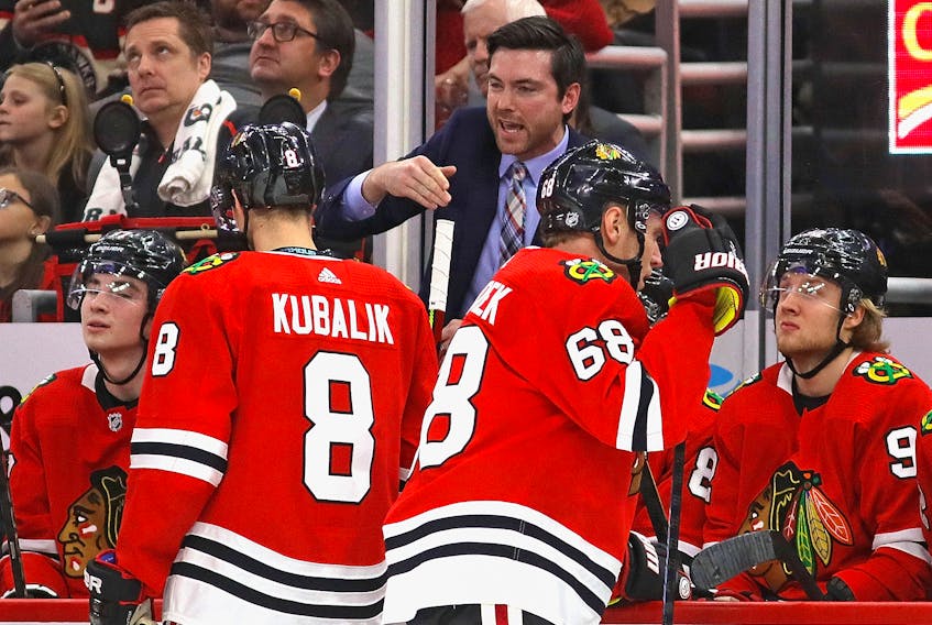 Chicago Blackhawks head coach Jeremy Colliton gives instructions to his team during a game in late December. (Jonathan Daniel/Getty Images)