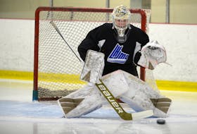 Goalie Colten Ellis tracks a shot during Tuesday’s Charlottetown Islanders’ practice at MacLauchlan Arena.