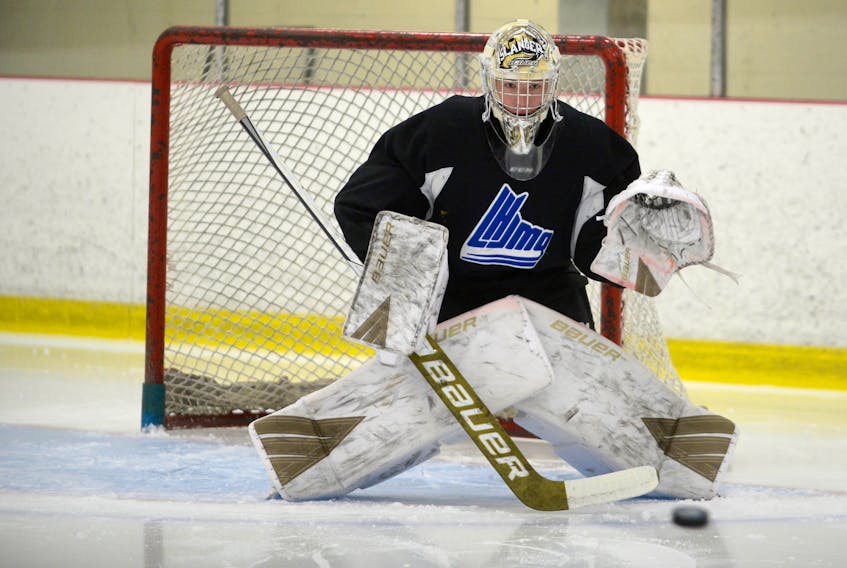 Goalie Colten Ellis tracks a shot during Tuesday’s Charlottetown Islanders’ practice at MacLauchlan Arena.
