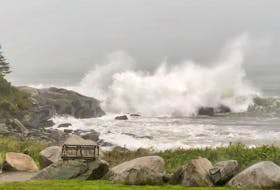 Lynn Winfield watched as Dorian unleashed crashing waves at Sandy Point in Shelburne, N.S. last September.
