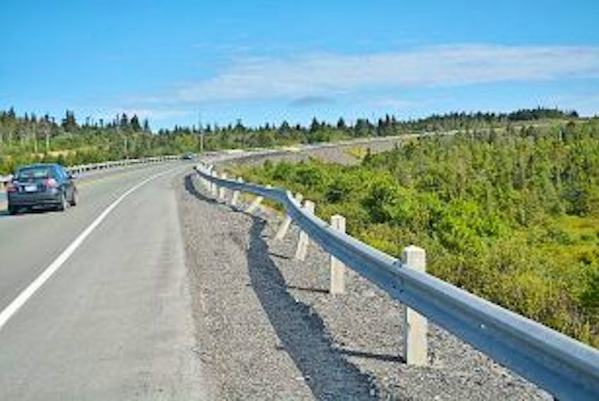 ['Nicholas Mercer/The Compass<br />This dented guardrail near the Harbour Grace turnoff of the Veterans Memorial Highway is one of a dozen such examples of damaged guardrails along the highway.']