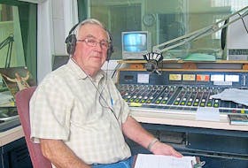 Submitted photo<br />Wilfred Button sits behind the microphone for his 800 Country radio program on VOWR.