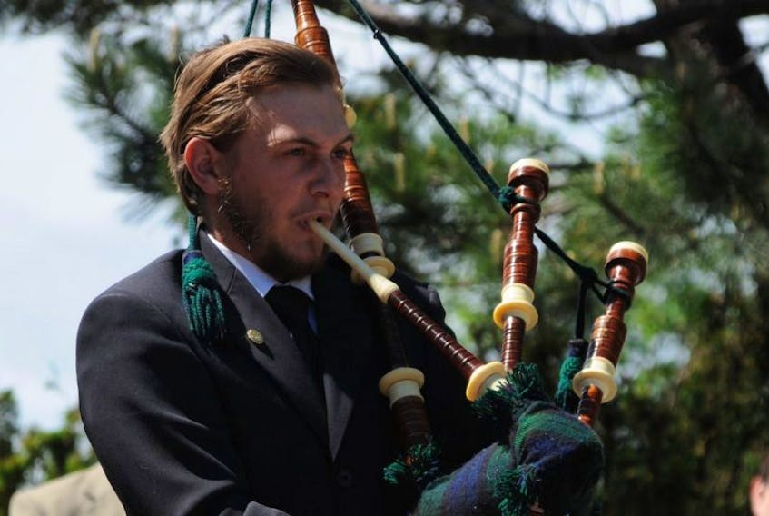 Joshua Chubbs of Carbonear, shown here performing on bagpipes during the town’s Memorial Day ceremony last year, faces multiple charges under the provincial Medical Act.