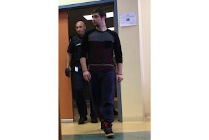 ['Lewis Sooley is shown entering a Harbour Grace courtroom earlier this month.']