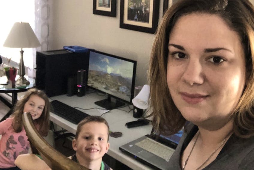 Tracy Carroll, far right, is about to get used to sharing a work environment with her two young children, Lauren and Jacob. — CONTRIBUTED PHOTO