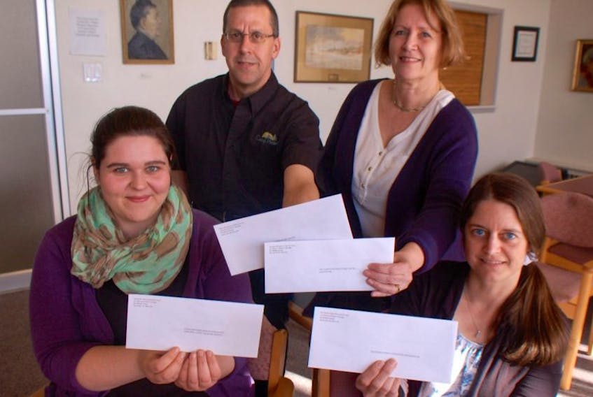 <p>(L to R) The Yarmouth Area Community Fund distributed cheques to Grace Flight, with the Canadian Mental Health Association; Anson d’Entremont, chairperson of the Camp Peniel board; Debbie Cook with the Tri-County Pregnancy Centre and Southwest Early Childhood Intervention executive director Valerie Gullison-Surette on April 13.<br />CARLA ALLEN PHOTO</p>