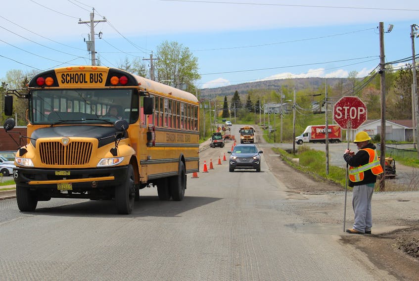 In this Cape Breton Post file photo from June 2019, a construction worker holds a stop sign while controlling traffic through road construction on Shore Road in Eskasoni. Workers like these need special safety and training certificates, which require regular in-person courses to renew. During the restrictions in place across Nova Scotia to prevent the spread of COVID-19, workers can't get these tickets renewed and aren't sure if the expiry dates will be extended. NICOLE SULLIVAN/CAPE BRETON POST 