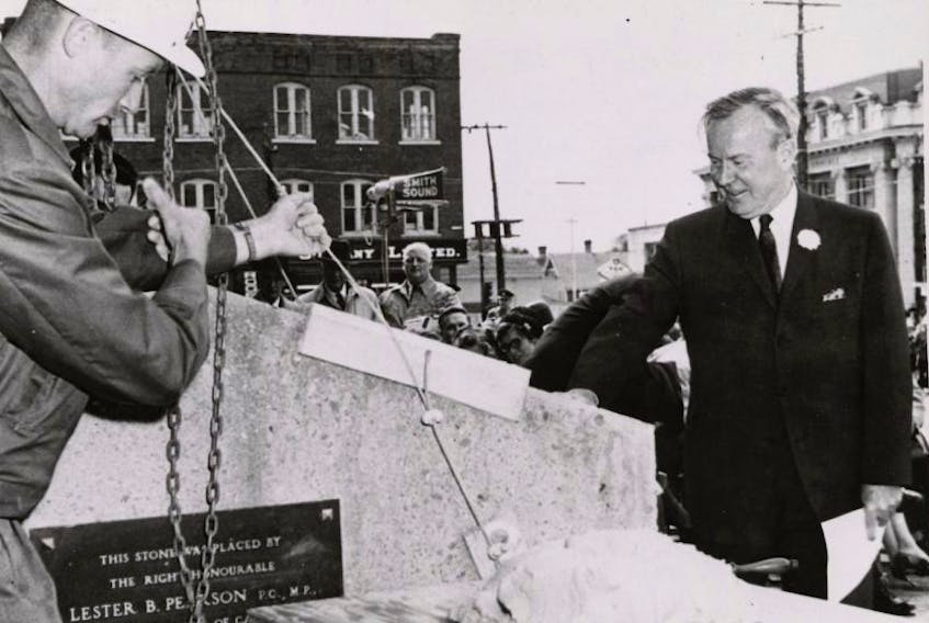 Prime Minister Lester B. Pearson, right, and assistant superintendent of Pigott Construction Jack Rivett, left, lay the cornerstone of Confederation Centre of the Arts on Aug. 26, 1963.