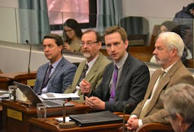 Representatives of the department of Environment, Water and Climate Change take questions during a standing committee meeting. From left are Environment, Water and Climate Change Minister Brad Trivers, Bruce Raymond, Brad Colwill and George Somers. Stu Neatby/THE GUARDIAN
