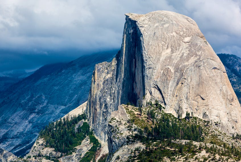 Half Dome in California is constituted from granite, a relatively less dense type of rock.