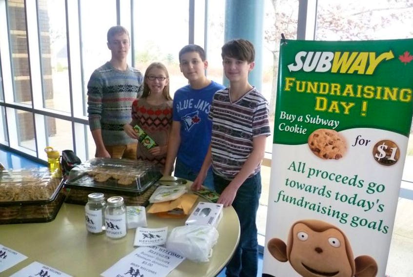<p>Students Adam Peck, Payton Tupper, Cole Robbins, and Owen Wood raised $200 for the Digby Welcomes Refugees group by selling cookies at Digby Regional on Dec. 16 and 17.</p>