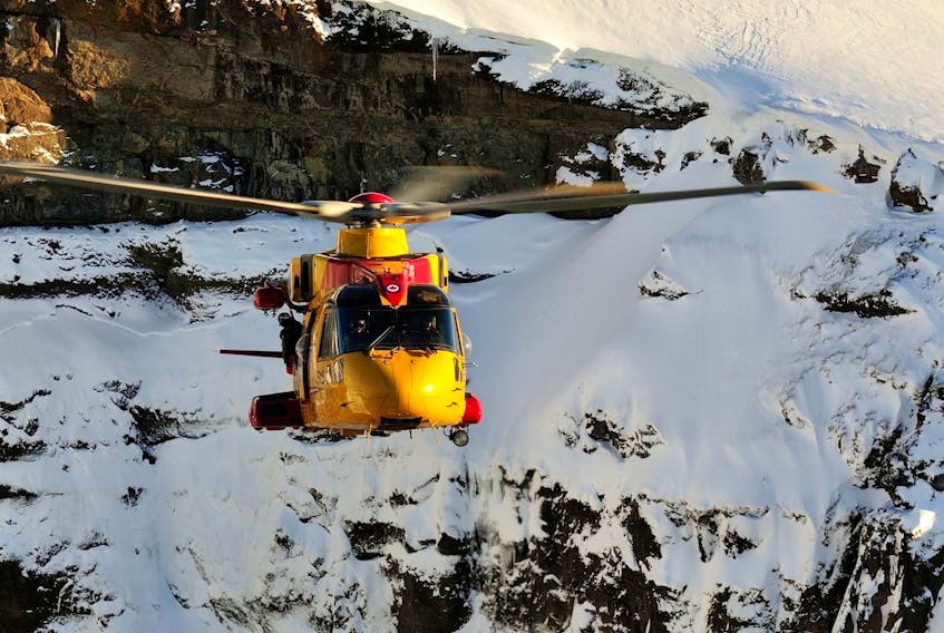 Members from 103 Squadron Gander, NL position the CH-149 Cormorant helicopter to perform a mountain rescue scenario during a Joint SAR Exercise held in Iceland on February 10, 2016. 

Photo: Master Corporal Johanie Maheu, 14 Wing Imaging, Greenwood 
GD2016-0075-14