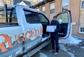 Steve Zahanov, owner of Sorrento in Corner Brook, does a curbside delivery of some of the free meals that have been donated to essential workers in the city. 
Contributed
