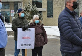 Heber Oldford braved the cold in Corner Brook on Monday to add his voice to a protest calling on the province to make good on a promise to put a PET scanner in the new hospital.