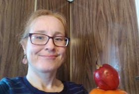 Bonnie Lou Hutchings, holding a tomato and red tamarillo, is promoting healthy eating as a volunteer for facilitator for Western Health's Improving Health: My Way and Colour it Up programs. CONTRIBUTED