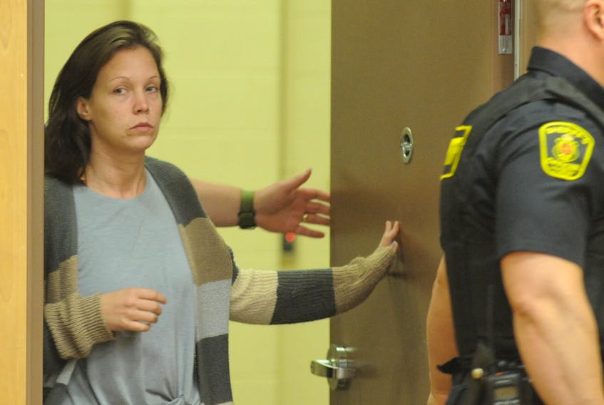 Nicole McKinnon, shown during an earlier court appearance, was acquitted Friday of two counts of fraud and unauthorized use of a credit card. FILE PHOTO