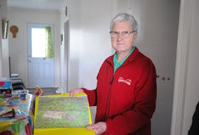 Margaret Hicks displays a picture of a rat caught in a trap she set in the backyard of her home on Concord Avenue in Corner Brook. STEPHEN ROBERTS PHOTO