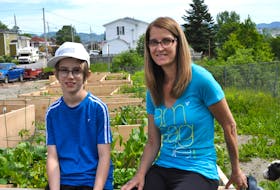 There’s lot of growth happening in the raised garden boxes behind Joel Lyver and his mom Jenny Lyver at the Caribou Road community garden in Corner Brook.