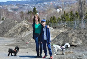 Jenny Lyver and her son, Joel Lyver, hope they’ll be successful in getting a plot at the new community garden to be located on Caribou Road in Corner Brook. They stopped by the site, a former playground, with their dogs, Mr. Fluffy Pants, at left, and Miss Daisy on Thursday.
Diane Crocker	
