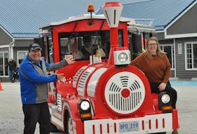 Corner Brook Mayor Jim Parsons, left, Mill Whistler driver Martin Batstone and Glenda Simms took the street train to Mountain View Retirement Centre with some special packages for the residents on Wednesday.
Diane Crocker
