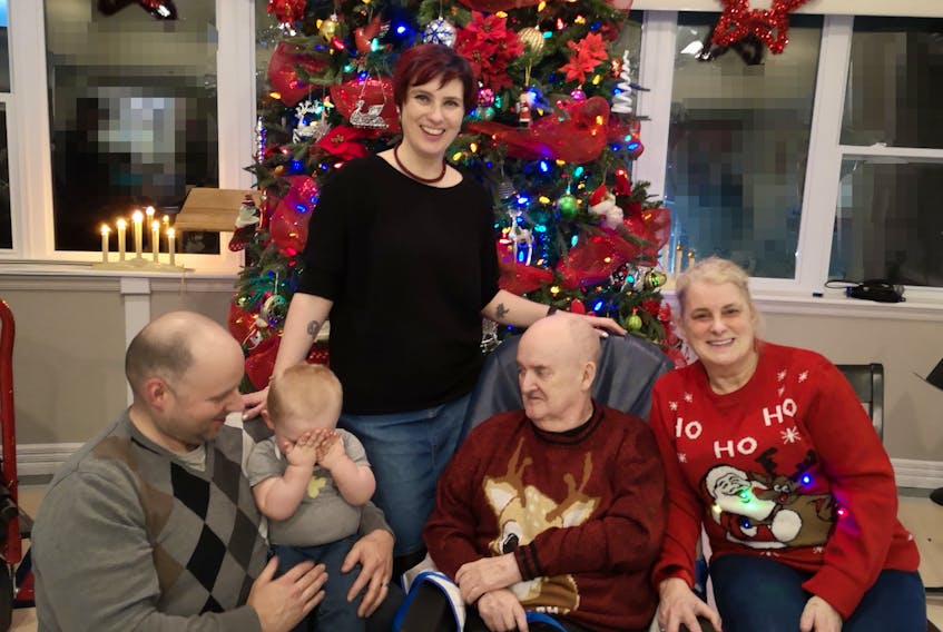 Shelia Lane, standing, of Middle Cove is finding grieving the loss of her father is a different experience during the COVID-19 pandemic. Her family, from left, husband Ryan Lane, son George, father Lindsay Tulk and mother Sylvia Tulk are seen in a picture taken during a Christmas celebration. 
Contributed