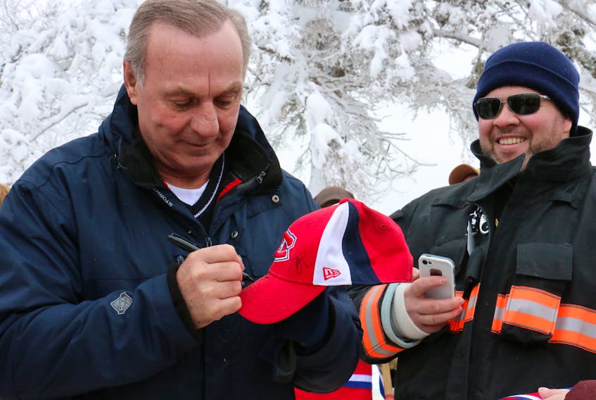 Former NHLer Guy Lafleur was a popular man when he arrived in Windsor in 2016, taking time to sign autographs everywhere he went. Also pictured is Windsor firefighter Graham Driscoll. Every year, firefighters volunteer their time at Long Pond, helping direct traffic and provide medical first response should it be required.