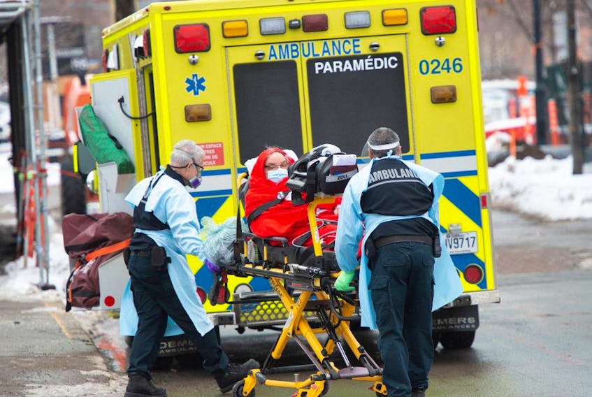 A patient is transported from Verdun hospital Tuesday, January 12, 2021  in Montreal.