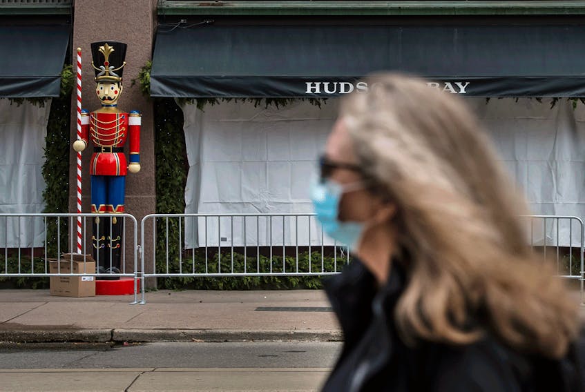  Christmas decorations being set up outside of Hudson’s Bay flagship store in Toronto on Oct. 29. The current COVID outlook doesn’t promise a huge number of good times ahead.