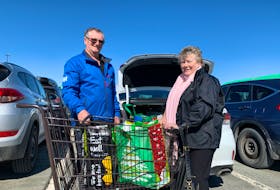 Lynda and Jerry Birrett stop to talk about the Covid-19 scare and do some shopping. Experts say being prepared doesn't hurt but there's no need to hoard. - Nebal Snan