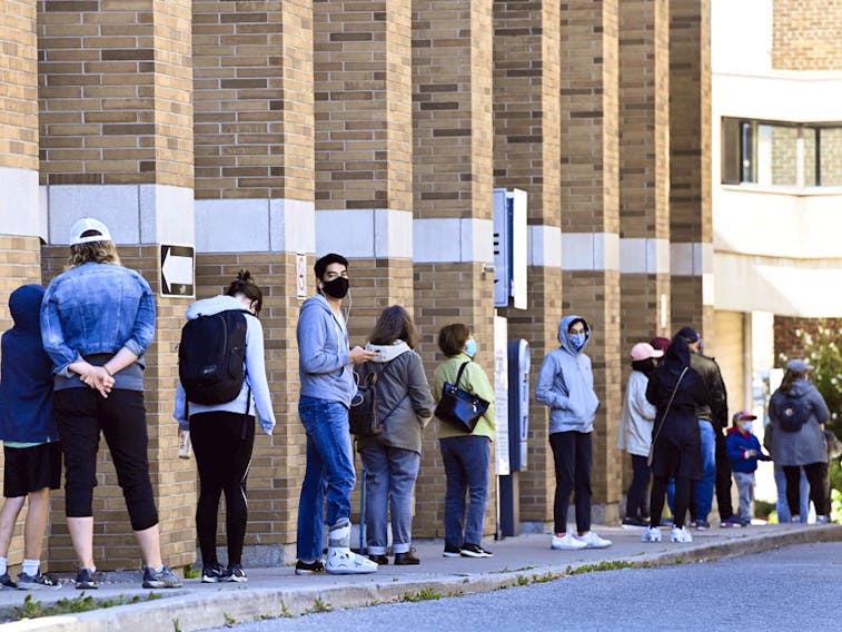  People line up at a COVID assessment centre in Toronto on Friday, Sept. 18.