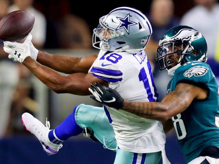 Cowboys receiver Randall Cobb (left) attempts to make a catch against the Eagles during first half NFL action in Arlington, Texas, on Oct. 20, 2019.