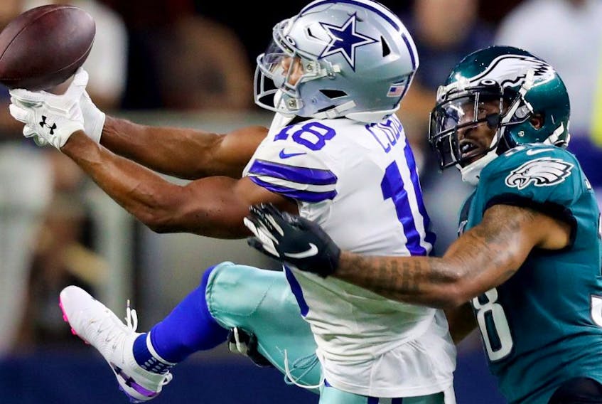 Cowboys receiver Randall Cobb (left) attempts to make a catch against the Eagles during first half NFL action in Arlington, Texas, on Oct. 20, 2019.