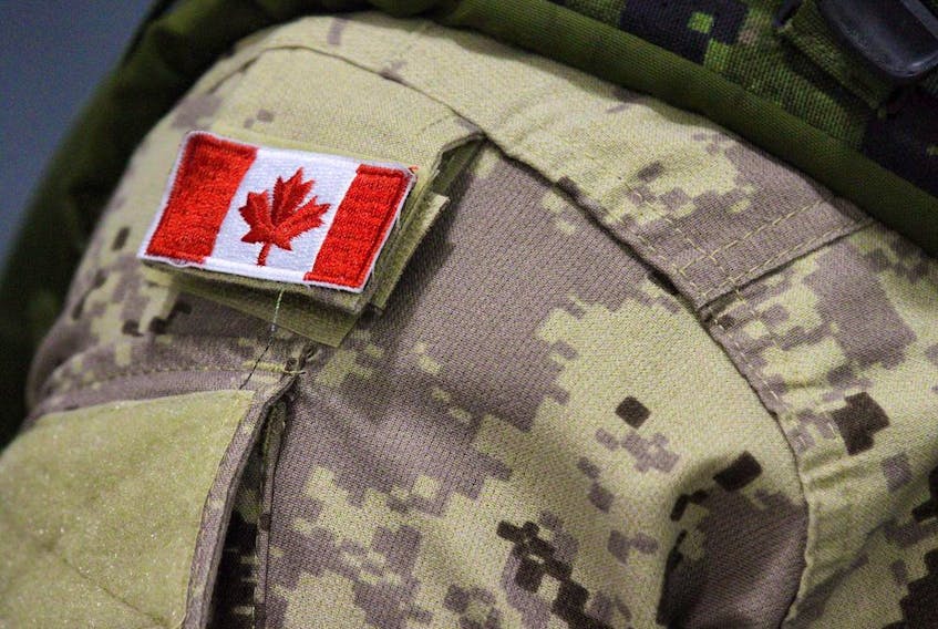 A Canadian flag patch is shown on a soldier's shoulder in Trenton, Ont., on Thursday, Oct. 16, 2014. File photo. 