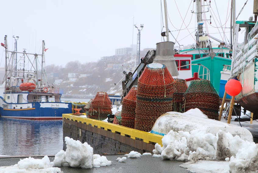 Crab pots piled on the wharf at the small boat basin on the south side of St. John's Harbour earlier this week. The start of year's snow crab fishery has been delayed to at least April 20. Glen Whiffen/The Telegram - Saltwire