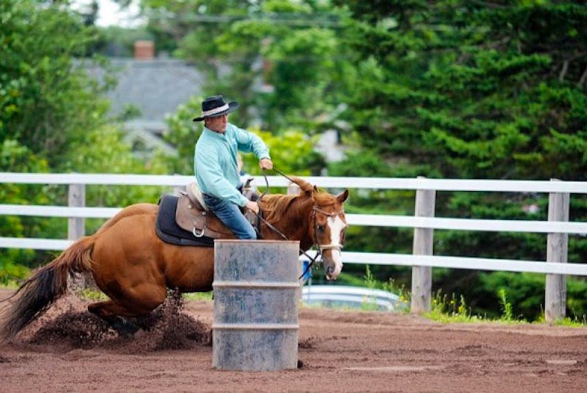 A rider certainly has to know how to handle a horse during the barrel racing during the Crapaud Exhibition.