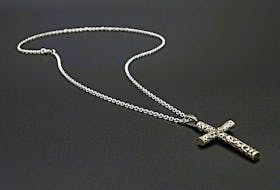 Stock image of crucifix neck chain.