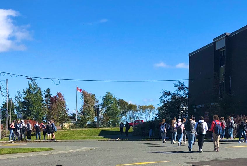 Students stand in small, socially-distanced groups during lunch break at Riverview High School on Friday. NICOLE SULLIVAN/CAPE BRETON POST 