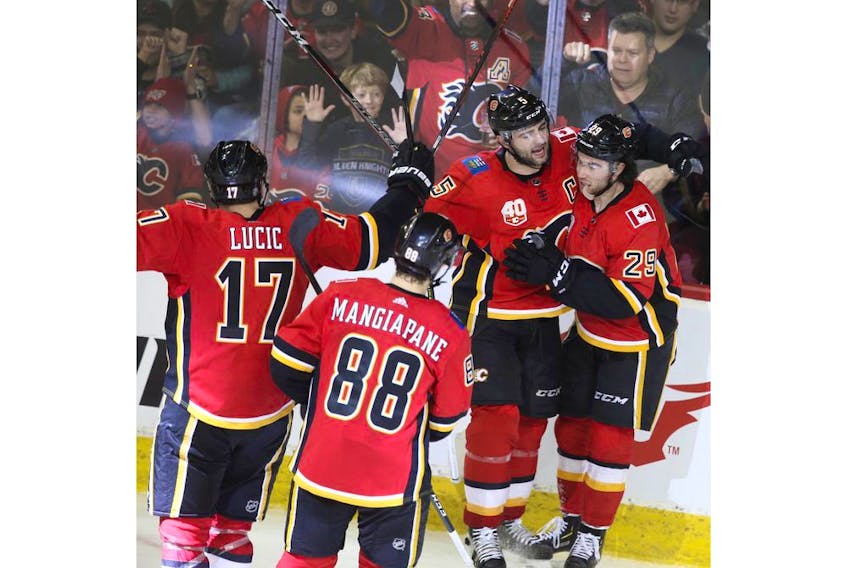 Dillon Dube celebrates a goal with teammates as the Calgary Flames battle the Vegas Golden Knights at Scotiabank Saddledome on March 8, 2020. Jim Wells/Postmedia