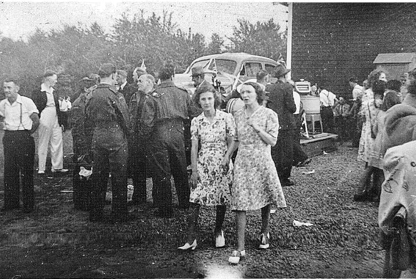 Picnics were popular in the 1940s. At this event at Acadia Hall, the prize for the winner of the raffle was a car (seen in the background).