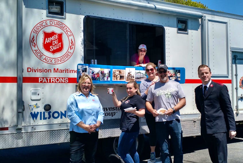 The Salvation Army is providing a food truck for the free meal food truck program beginning in October. Here, the truck is pictured on-site at a previous event, with volunteers and lots of snacks.