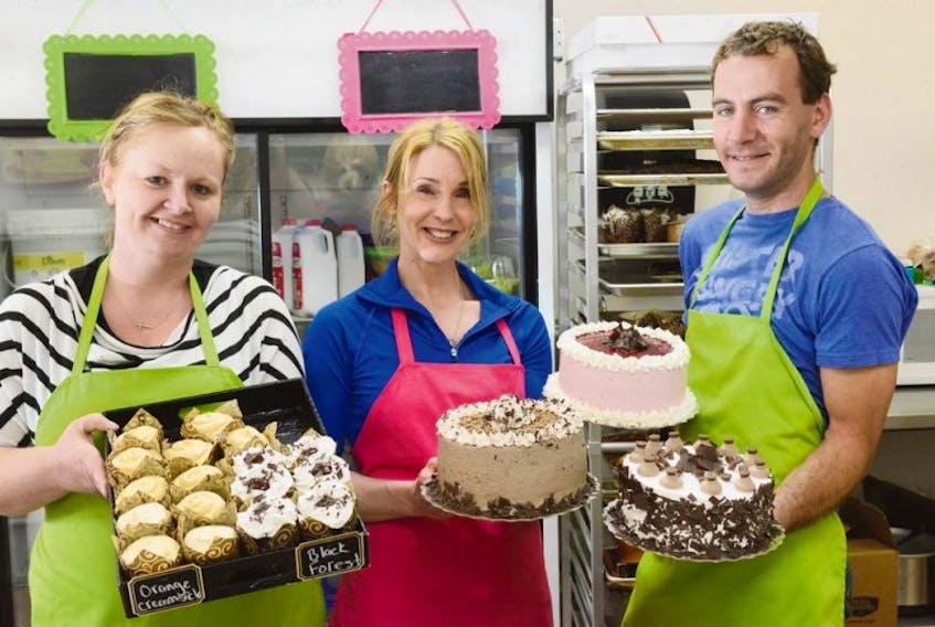<p>Candi Clements, left, owner and operater of Candi’s Cupcakes, and two members of her staff, Cheryl Kerr and Manuel Quesnel, are now whipping up specialty cupcakes and cakes in downtown Charlottetown. With the help of another employee, Anne Van Donkersgoed (not pictured), Clements is now offering a lunch menu in addition to the sweet treats.</p>