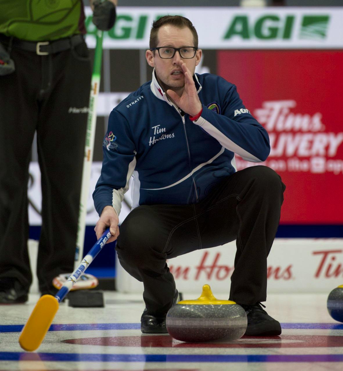 Ontario’s Scott McDonald, who has joined the Nova Scotia rink as skip at the Tim Hortons Brier in Calgary, yells instruction to his team during Draw 3 play Saturday. Nova Scotia defeated P.E.I. 11-4 to even its record at 1-1. - Michael Burns / Curling Canada