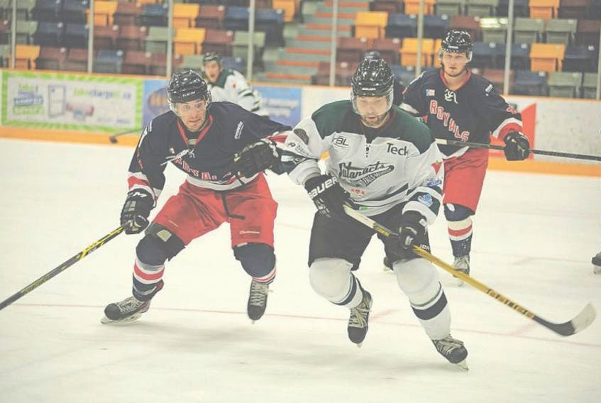 In this Dec. 13, 2015 file photo, plenty of empty seats are visible at the Corner Brook Civic Centre as Steven Yetman (front right) of the Grand Falls-Windsor Cataracts and Ryan Watson (left) of the Corner Brook Royals chase a loose puck during Central West Senior Hockey League play. In a CBC radio interview this week, CWSHL president Neil Norcott of Clarenville suggested a drop in fighting in games is the main reason for dwindling attendance, but a couple of veteran senior players contacted by The Telegram aren’t so sure.