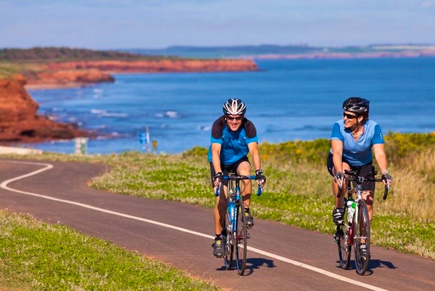 Cyclists on bicycle trail, Gulf Shore Parkway, Prince Edward Island National Park